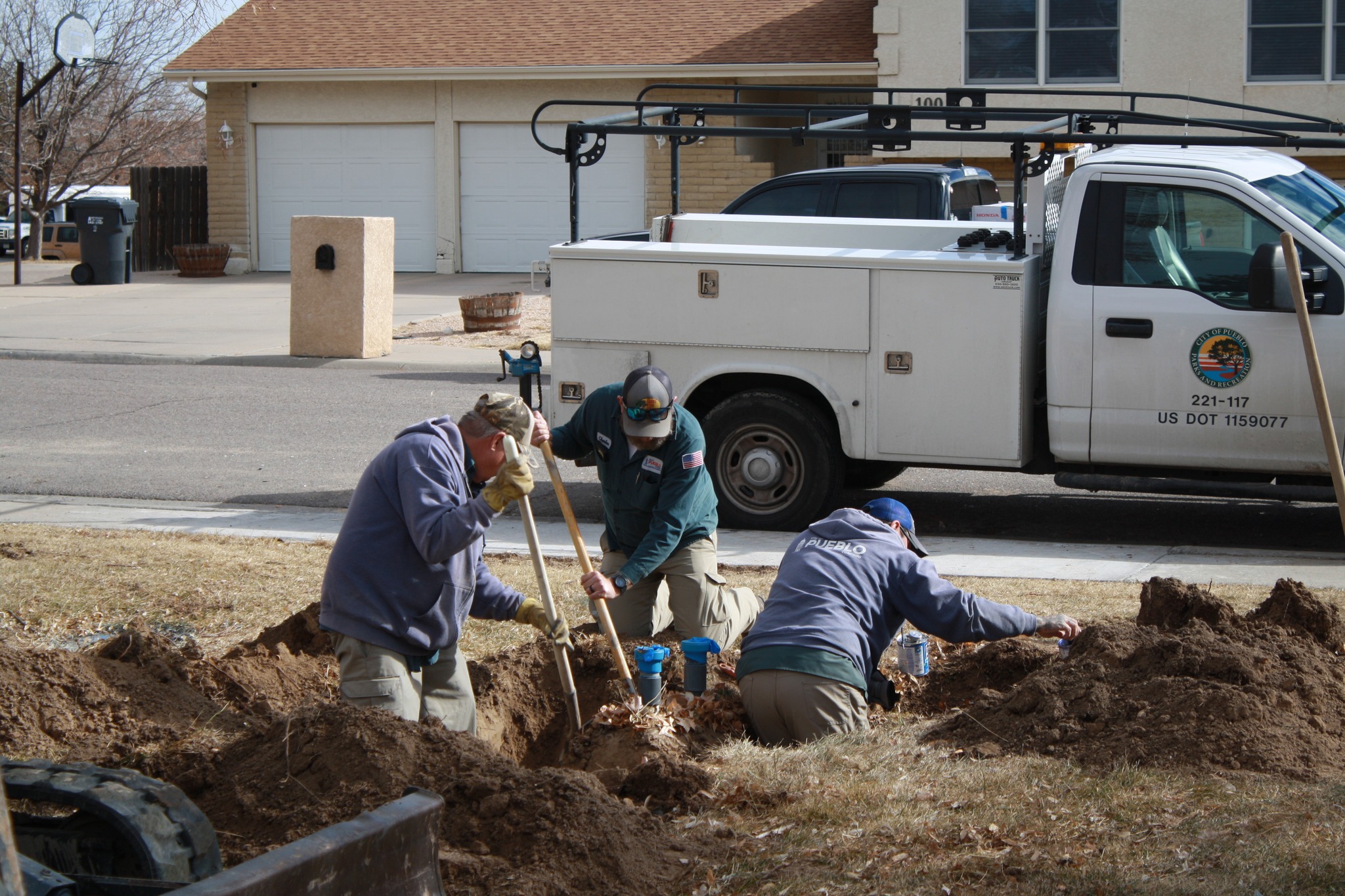 Image 9 of 14 in gallery section. Image title is City Parks Workers Digging.