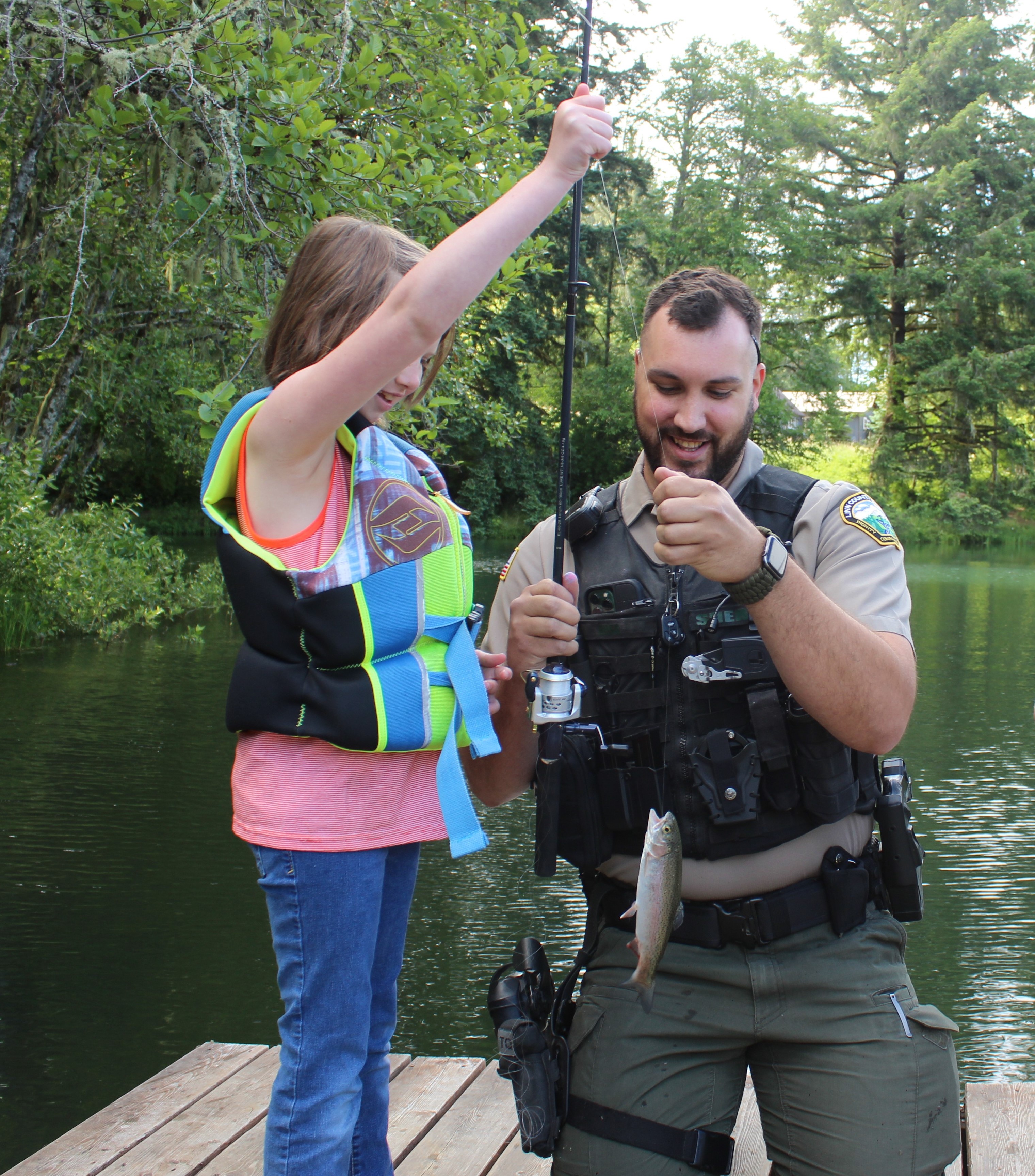 Image 11 of 18 in gallery section. Image title is Ross with kiddo fishing.