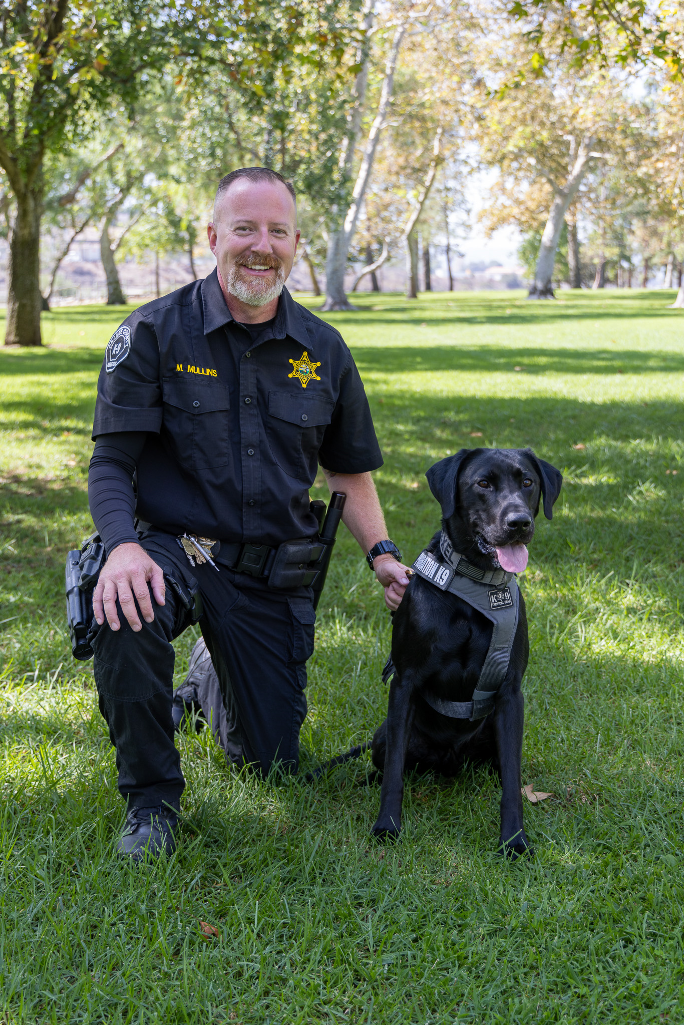 Image 2 of 10 in gallery section. Image title is Officer Mullins and K-9.