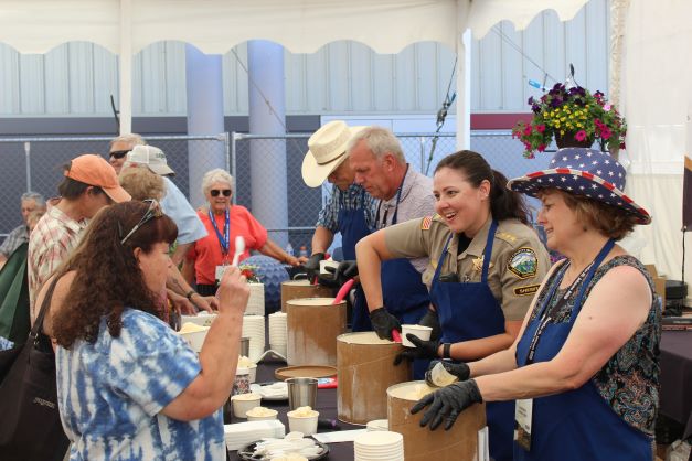 Image 6 of 18 in gallery section. Image title is Sheriff scooping ice cream.
