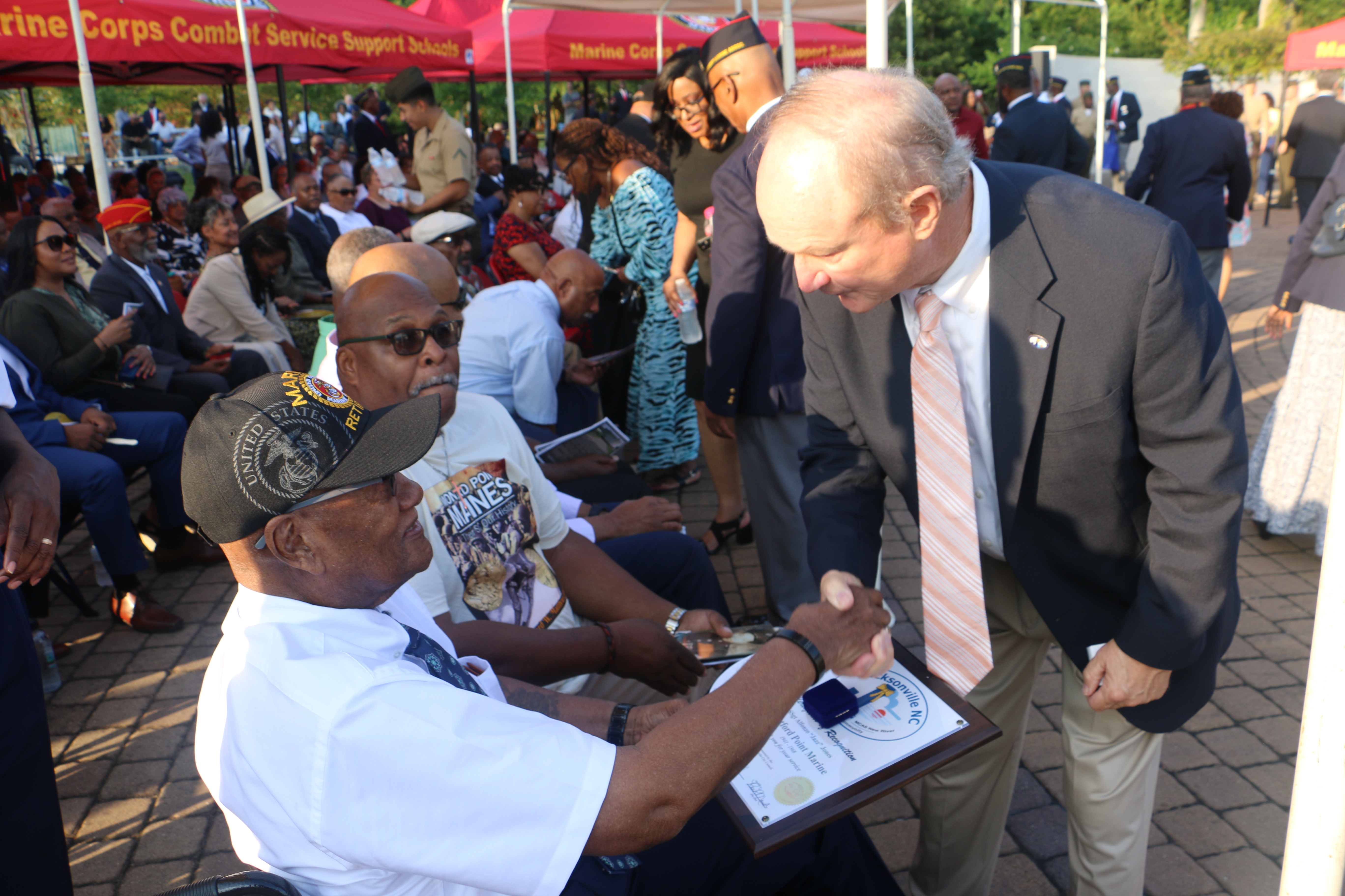 Image 2 of 9 in gallery section. Image title is Mayor and retired Marine.